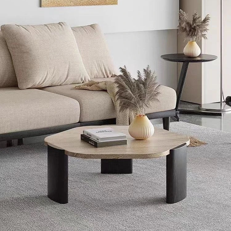 Modern living room with a beige sofa, wooden coffee table, and decorative elements.