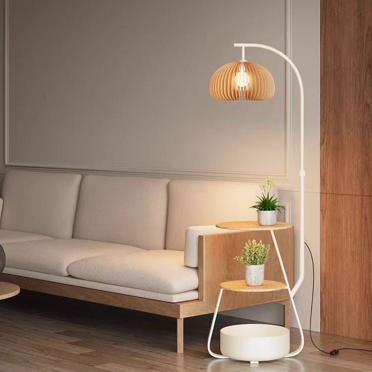 White version of the arc lamp plant stand showing a minimalist white finish.