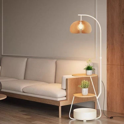 White version of the arc lamp plant stand showing a minimalist white finish.